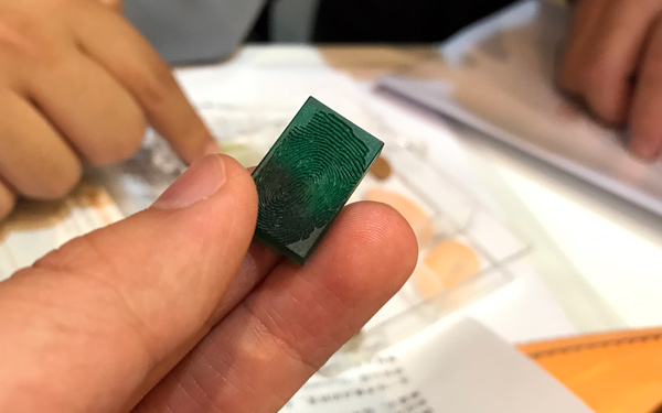 A duplicate fingerprint mold is on display by Precise Biometrics Inc in February, 2017, during the Mobile World Congress held in Barcelona, Spain. (Photo/chinadaily.com.cn)