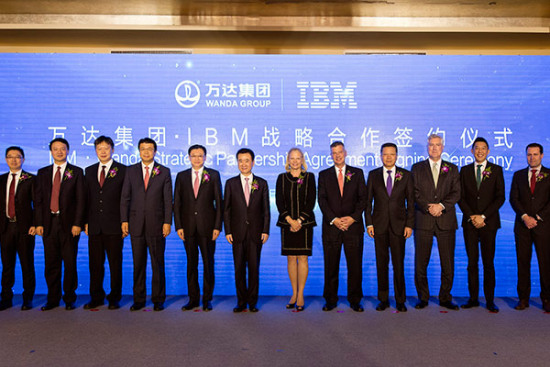 Wanda Group chairman Wang Jianlin and IBM chief executive Ginni Rometty(center) pose for pictures at a partnership agreement signing ceremony in Beijing, March 19, 2017. (Photo provided to chinadaily.com.cn)