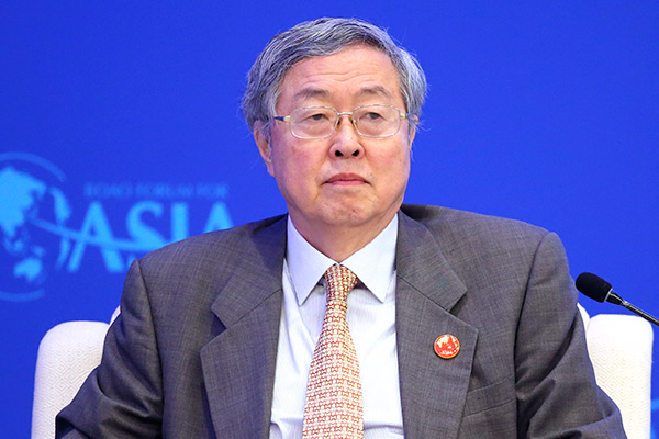 Zhou Xiaochuan, China's central bank governor, speaks at a plenary session of the Boao Forum for Asia in Hainan province, Mar 25, 2017. (Photo/Feng Yongbin)