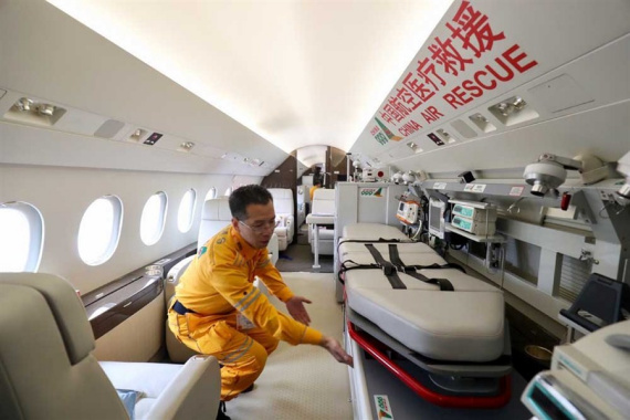 An employee demonstrates some of the facilities on a rescue aircraft at the 2017 Asian Business Aviation Conference and Exhibition in Shanghai yesterday. The city is planning an airport for general aviation that will also accommodate rescue aircraft.  (Photo: Shanghai Daily/Dong Jun)