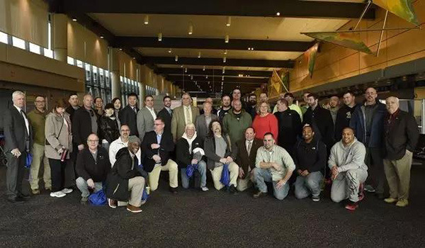 CRRC MA employees pose for a group photo at Bradley International Airport.(Photo/CRRC's official WeChat account)
