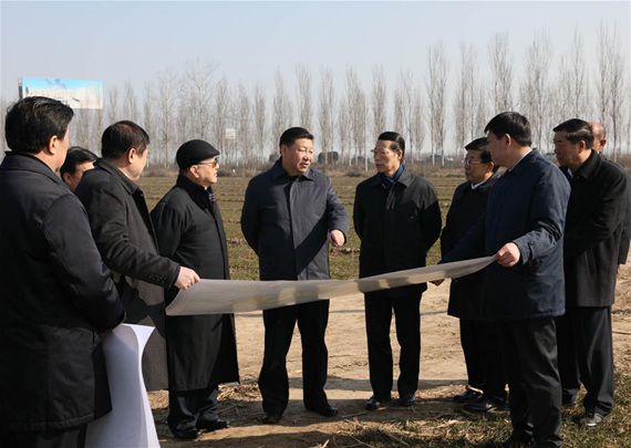 Chinese President Xi Jinping(C) inspects the Xiongan New Area scheme in Anxin County of Baoding City, north China's Hebei Province, Feb 23, 2017. Xiongan New Area, an economic zone about 100 kilometers south of Beijing, will span Xiongxian, Rongcheng and Anxin counties in Hebei Province, covering 2,000 square kilometers in the long term with a population of 2 to 2.5 million. (Xinhua/Lan Hongguang)