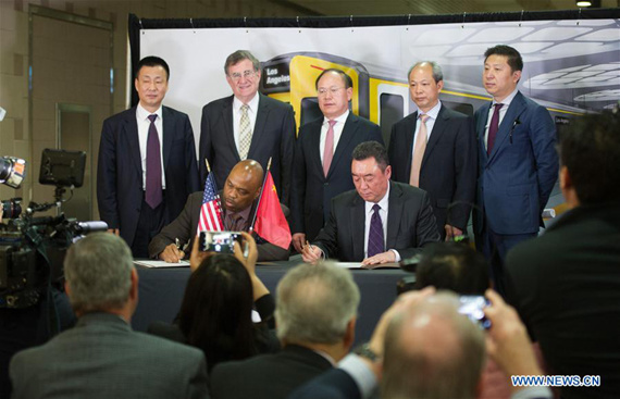 China Railway Rolling Stock Corporation (CRRC)President Xi Guohua (4th R) attends the signing ceremony in Los Angeles, the United States, April 12, 2017. LA Metro on Wednesday signed a 647 million-U.S.-dollar contract to purchase 282 rail cars from CRRC. (Xinhua/Yang Lei)