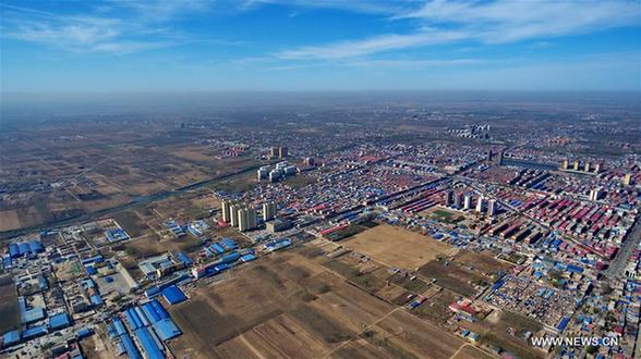 Aerial photo taken on April 1, 2017 shows Xiongxian County, north China's Hebei Province. China announced Saturday it would establish the Xiongan New Area in Hebei Province, as part of measures to advance the coordinated development of the Beijing-Tianjin-Hebei (BTH) region. The New Area, about 100 km southwest of downtown Beijing, will span three counties that sit at the center of the triangular area formed by Beijing, Tianjin and Hebei's provincial capital Shijiazhuang. (Xinhua/Wang Xiao)