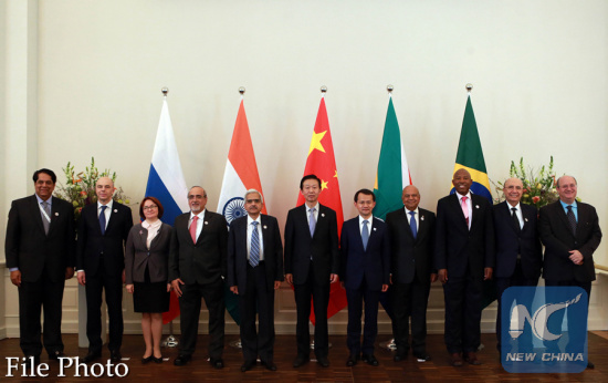 Representatives pose for a group photo during the BRICS summit for finance ministers and central bankers in Germany's southwestern city of Baden-Baden, March 17, 2017. (Xinhua/Luo Huanhuan)