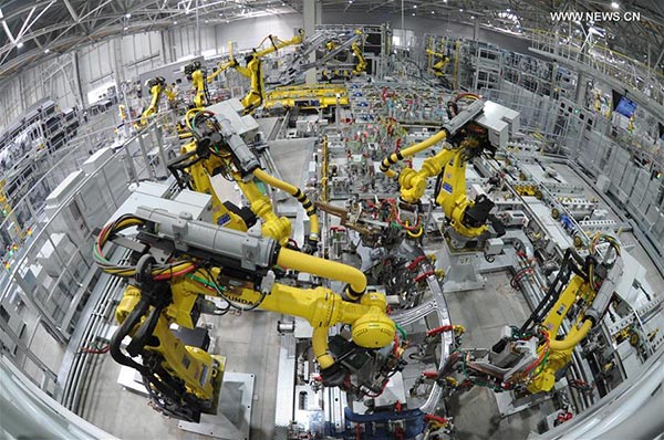Robots work on a production line at a car factory in Cangzhou city, north China's Hebei Province, Oct. 18, 2016. (Photo/Xinhua)