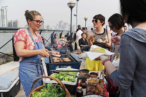 A woman sells British food from her startup on the Bund.Yang Yi / For China Daily