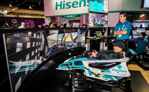Visitors examine Hisence TVs at the CES in Las Vegas, the United States. XINHUA