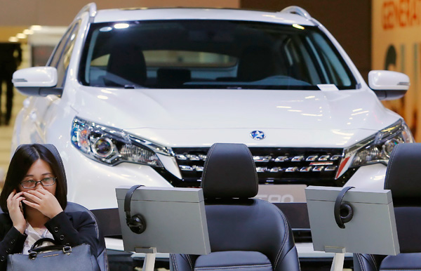 A visitor at the auto show in Shanghai in April. In the first four months of this year, auto sales in the country stood at 7.27 million, a drop of 1.4 percent year-on-year. YIN LIQIN / FOR CHINA DAILY