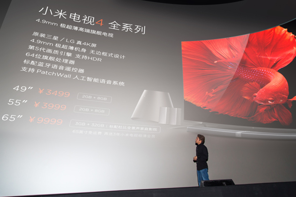 Wang Chuan, co-founder of Xiaomi Corp, introduces the latest Mi TV 4 at a product launch in Beijing on May 18. (Photo provided to chinadaily.com.cn)