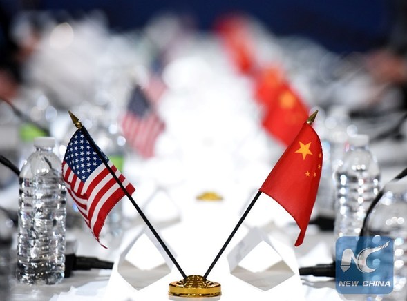 File photo taken on Nov. 23, 2016 shows the national flags of the United States and China during the 27th Session of the China-U.S. Joint Commission on Commerce and Trade (JCCT) in Washington D.C., capital of the United States. (Xinhua/Yin Bogu)