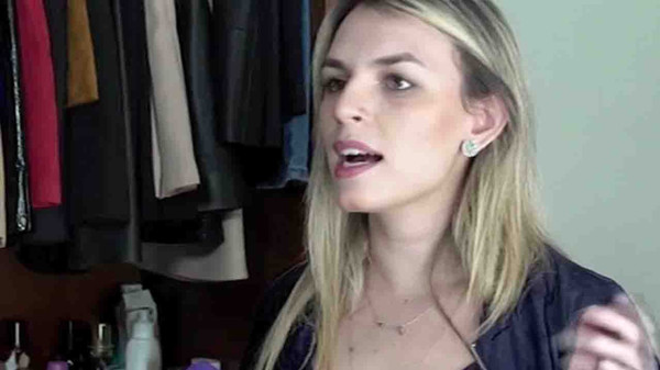 Nathalia Penteado tells the reporter she has switched to cheaper cosmetics products.(CGTN photo)