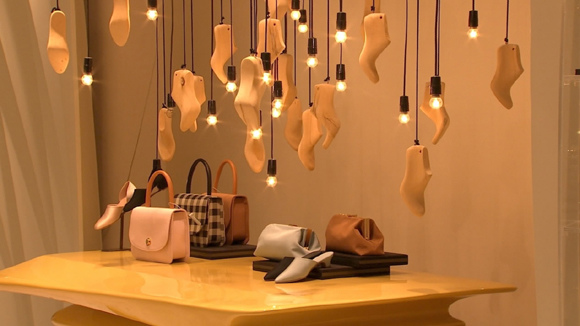 Bags and shoes on display in Lane Crawford in Hong Kong.  (Photo/CGTN)