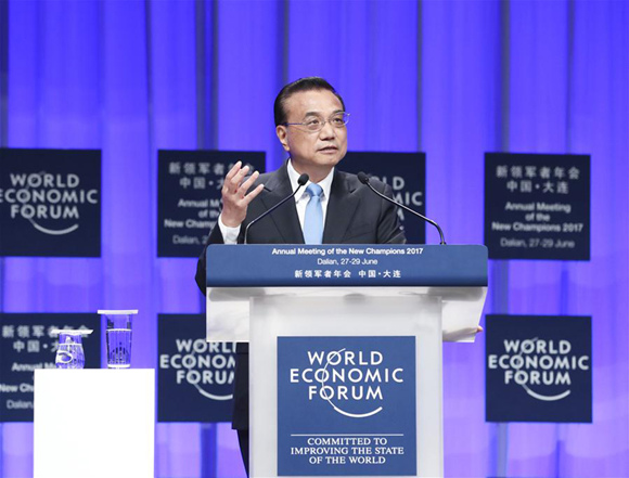 Chinese Premier Li Keqiang addresses the opening ceremony of the Annual Meeting of the New Champions 2017, or Summer Davos, in the city of Dalian, northeast China's Liaoning Province, June 27, 2017. (Xinhua/Pang Xinglei)