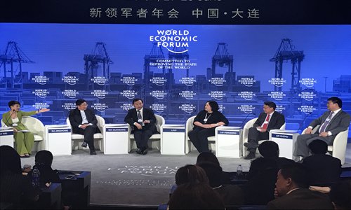 Senior company executives speak at a seminar at the annual Summer Davos in Dalian, Northeast China's Liaoning Province, on Wednesday. (Photo: Li Xuanmin/GT)