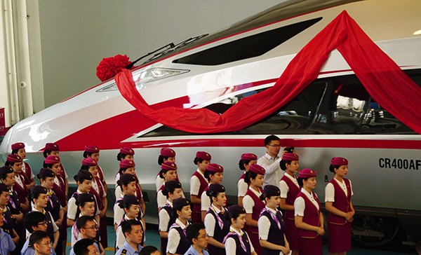 A naming ceremony for a Fuxing class bullet train is held in Beijing on Sunday. (Photo/Xinhua)