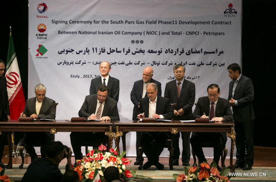 Representatives from cooperation parties attend the deal signing ceremony in Teheran, Iran, on July 3, 2017. (Xinhua/Ahamad Halabisaz)