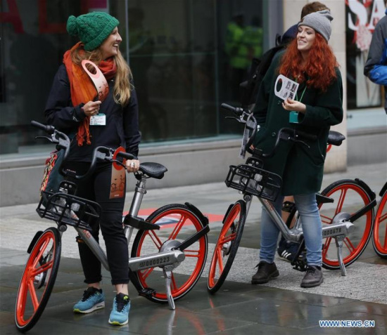 Cyclists try out the new Mobike in Manchester, Britain on June 29, 2017. Mobike, one of China's largest bike-sharing companies, launched its service in the Greater Manchester, Britain, on Thursday. (Xinhua/Craig Brough)