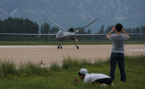 A mass-produced CH-5 reconnaissance/combat drone takes off for a test flight at an airport in Hebei province on Friday.  (Photo by WANG JING/CHINA DAILY)