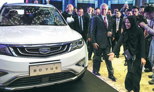 Chinese automaker Geely will inject cash and one SUV product for the 49.9 percent stake it has agreed to acquire in loss-making carmaker Proton to gain access to the booming Southeast Asian market. (Photo/Xinhua)