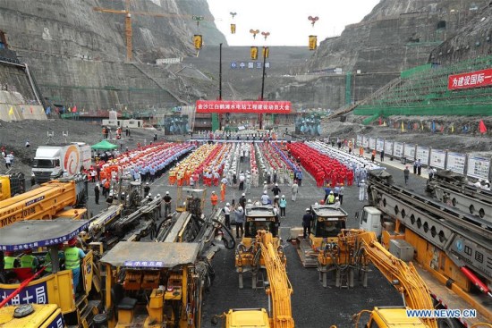A ceremony is held at the construction site of Baihetan project, which is located downstream of the Jinsha River, the upper section of the Yangtze, in Ningnan county of southwest China's Sichuan Province and Qiaojia county of neighboring Yunnan Province, on Aug. 3, 2017. (Xinhua/Sun Ronggang)