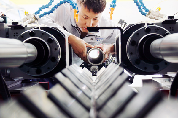 A technician operates a high-tech production line in Xuanhua, Hebei province. CHEN XIAODONG / FOR CHINA DAILY