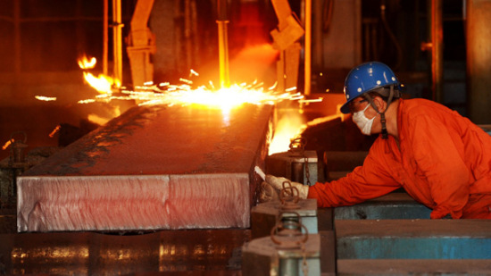 A worker operates a production line at a steel plant in Dalian, Liaoning province. LIU DEBIN / FOR CHINA DAILY