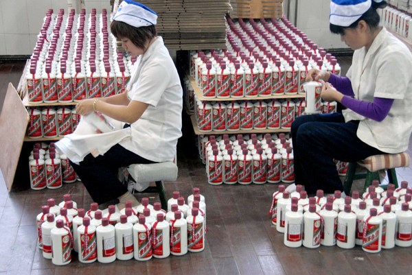 Kweichow Moutai Co workers package liquor at the company's production line in Maotai, Guizhou province. PROVIDED TO CHINA DAILY