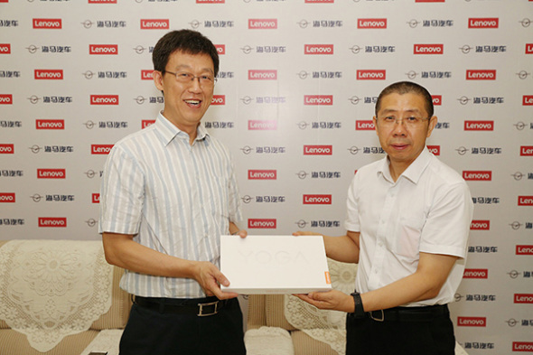 He Zhiqiang, president of Lenovo Capital and Incubator Group, and Sun Zhongchun, general manager of Haima Car Co Ltd, at a news conference in Zhengzhou, Henan province, Aug 16, 2017.