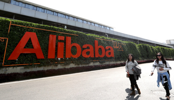 Two women walk inside Alibaba Group Holding Ltd's office area in Hangzhou, Zhejiang province. (Photo provided to China Daily)
