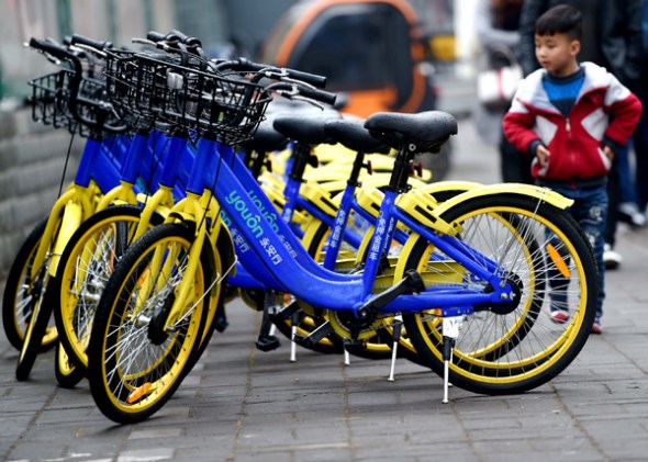 Parked Youon shared bikes on a street in Luoyang, Henan province. (Photo provided to China Daily)