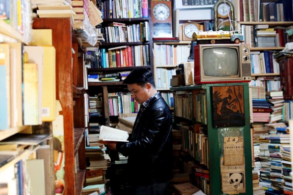 A customer browses the offerings at the Youhe Bookstore in Wuhan, capital of Hubei province. 