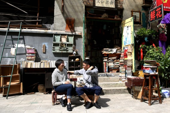 Literature enthusiasts chat outside the Youhe Bookstore.