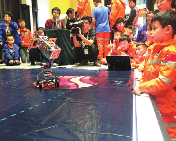 Children find out what makes a satellite tick at space startup Commsat Technology Development Co Ltd in Beijing. (Photo provided to China Daily)