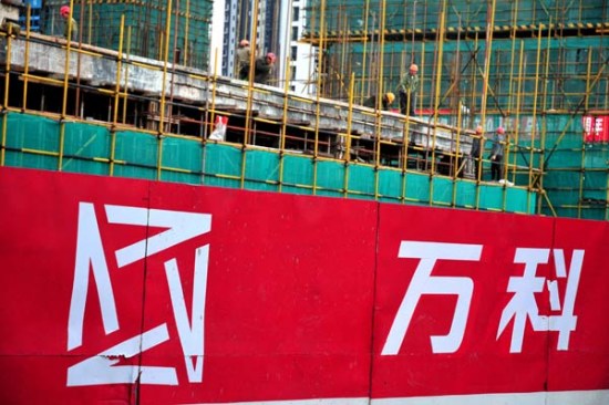 Workers build a property project for China Vanke Co in Fuzhou, capital of Fujian province. [Photo provided to China Daily]