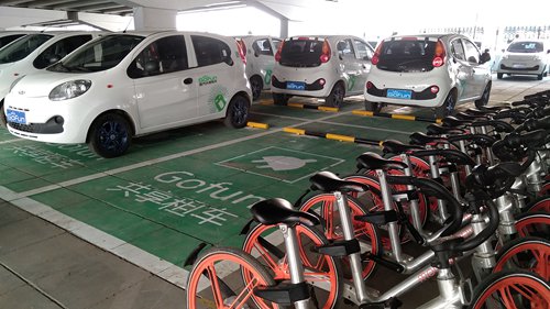Shared vehicles of Gofun are parked in one designated parking space under the Guomao Bridge, Beijing in March. (Photo/Courtesy of Gofun)