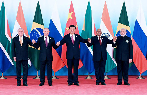 Leaders of BRICS countries pose for group photos after the ninth BRICS summit in the eastern city of Xiamen, Fujian province, Sept 4, 2017. (Photo/Xinhua)