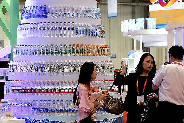 A tower of bottled water on display at the opening of the 11th China-Northeast Asia Expo in Changchun, capital of Jilin province earlier this month. (Wang Zhengdong/for China Daily)