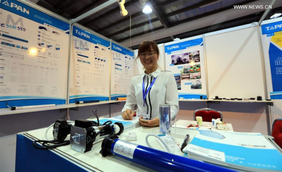 A woman works at a stall during the 14th China Expo (Jordan) in Amman, Jordan, on Sept. 6, 2017. The expo kicked off here on Wednesday, attracting 208 exhibitors from China. (Xinhua/Mohammad Abu Ghosh) 