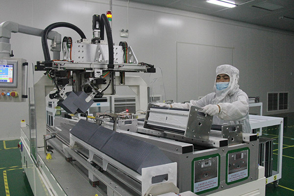 A staff member works at a China-invested photovoltaic technology company in Hanoi, Vietnam. (Photo/Xinhua)
