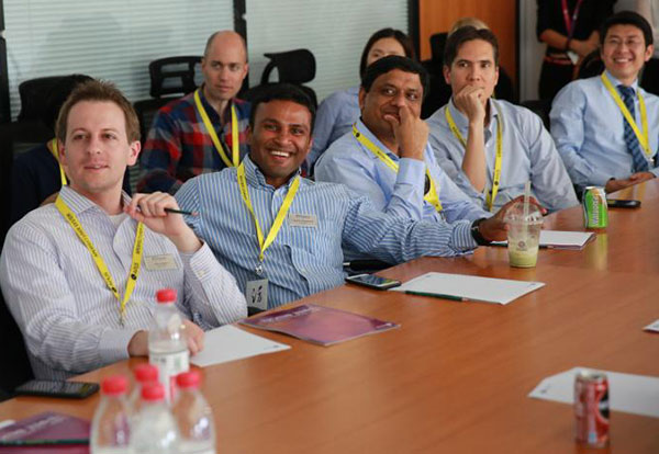 Students attending the MBA program for executives at Wharton School, University of Pennsylvania visit Chinese mobile internet startup APUS Group in Beijing, Sept 12, 2017. (Photo provided to chinadaily.com.cn)