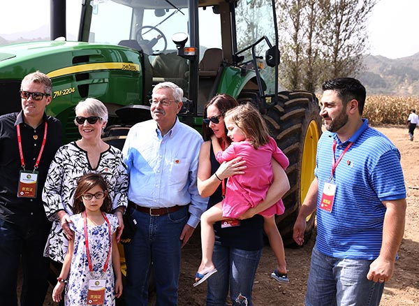 U.S. Ambassador Terry Branstad with his family member during the launch ceremony of China-U.S. Friendship Demonstration Farm in Luanping county, North China's Hebei province, on Sept 23, 2017. ZOU HONG / CHINA DAILY