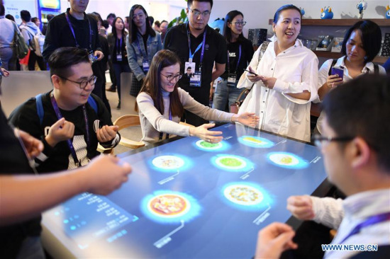 Visitors try self-ordering service at a restaurant of the future booth on The Computing Conference 2017 in Hangzhou, capital of east China's Zhejiang Province, Oct. 11, 2017. The four-day conference kicked off here on Wednesday, attracting guests from 67 countries and regions. (Xinhua/Huang Zongzhi)