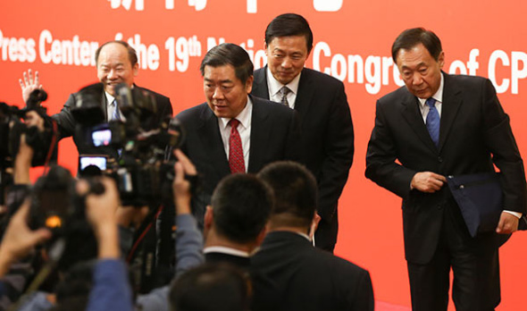 He Lifeng (front center), chairman of the National Development and Reform Commission, and Zhang Yong (far right) and Ning Jizhe (left), both vice-chairmen of the NDRC, take questions from reporters after a news conference at the press center of the CPC 19th National Congress on Oct. 21, 2017. (FENG YONGBIN/CHINA DAILY)