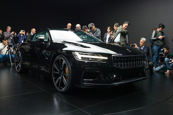 Visitors examine the newly-unveiled Polestar 1 high-performance coupe in Shanghai. (Photo by Hao Yan/China Daily)