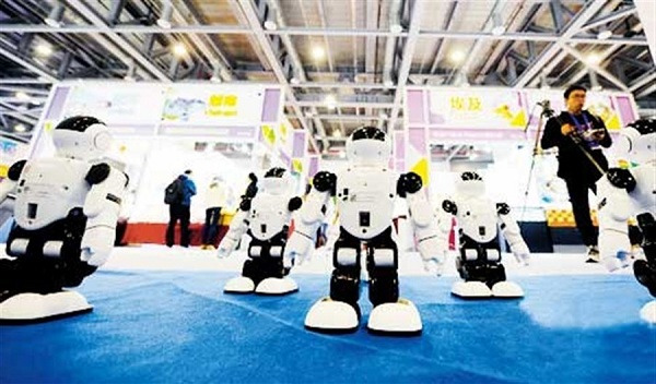 Xiaozhi, dancing robots developed by Hazzi Robotics, perform at the exhibition.(Photo/Shanghai Daily)