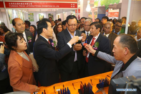 Mohan Bahadur Basent (C), Nepali Minister for Information and Communication, and Gao Shuxun (2nd L, front), head of China-South Asia Expo Executive Committee, visit stalls of the China-South Asia Expo 2017 in Kathmandu, Nepal, Nov. 2, 2017. (Xinhua/Sunil Sharma)