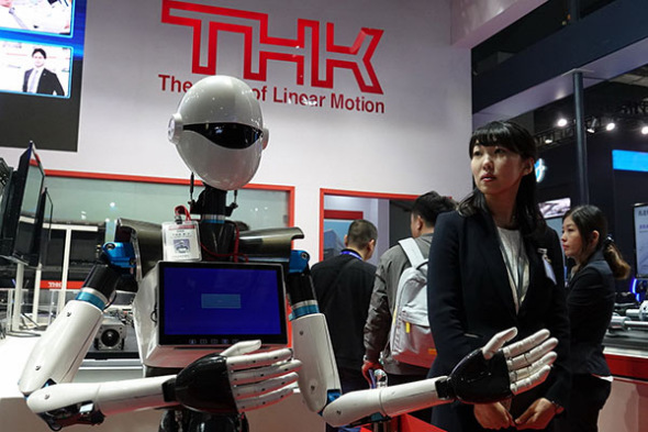 A robot developed by THK is shown at the 2017 China International Industry Fair in Shanghai on Wednesday. (GAO ERQIANG/CHINA DAILY)