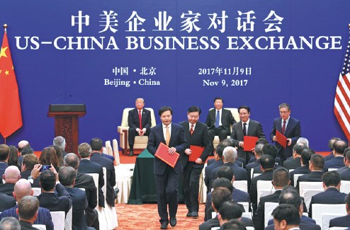 President Xi Jinping and U.S. President Donald Trump attend the closing ceremony of the U.S.-China Business Exchange in Beijing on Thursday. The two presidents delivered speeches at the event. Photo: China Daily/Wu Ziyi