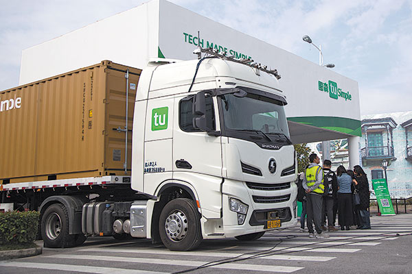 TuSimple Inc demonstrates minds-off automated driving using two modified trucks in Shanghai International Automobile City. (Photo provided to China Daily)